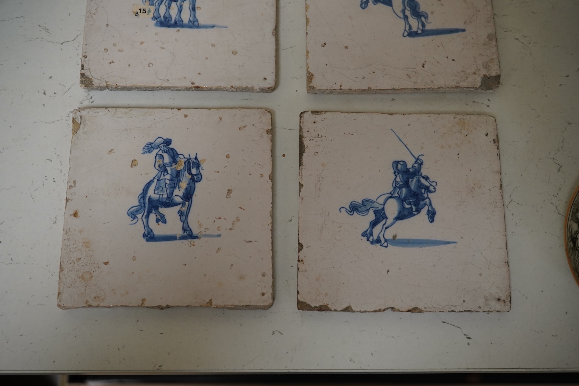 A collection of six assorted Delft tiles and one other, 18th century. Condition - varies